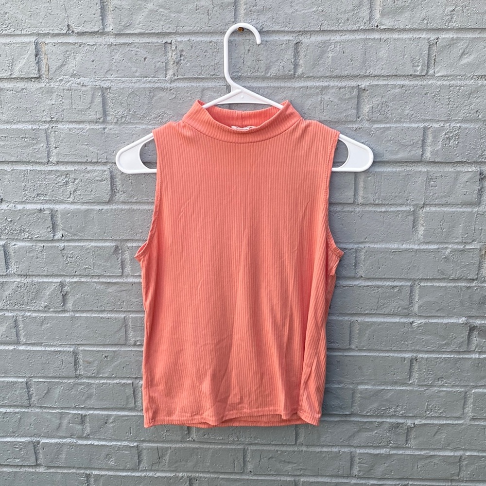 Used stretch blouse size Mediam Color peach without tag.